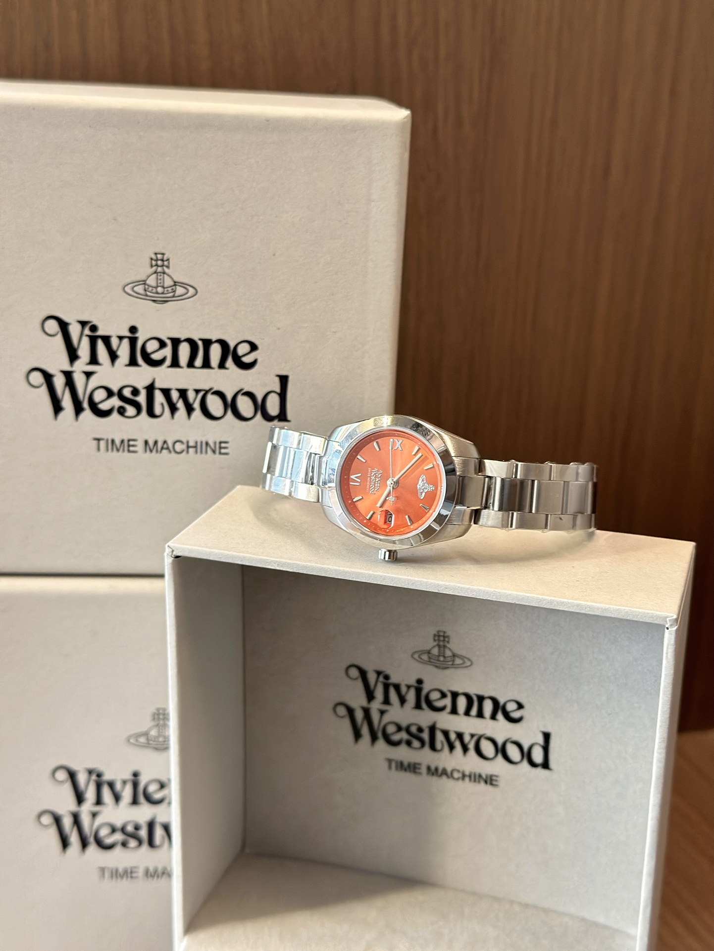 Distinguished by a bold orange dial paired with a silver-tone bracelet - Jewelry 9