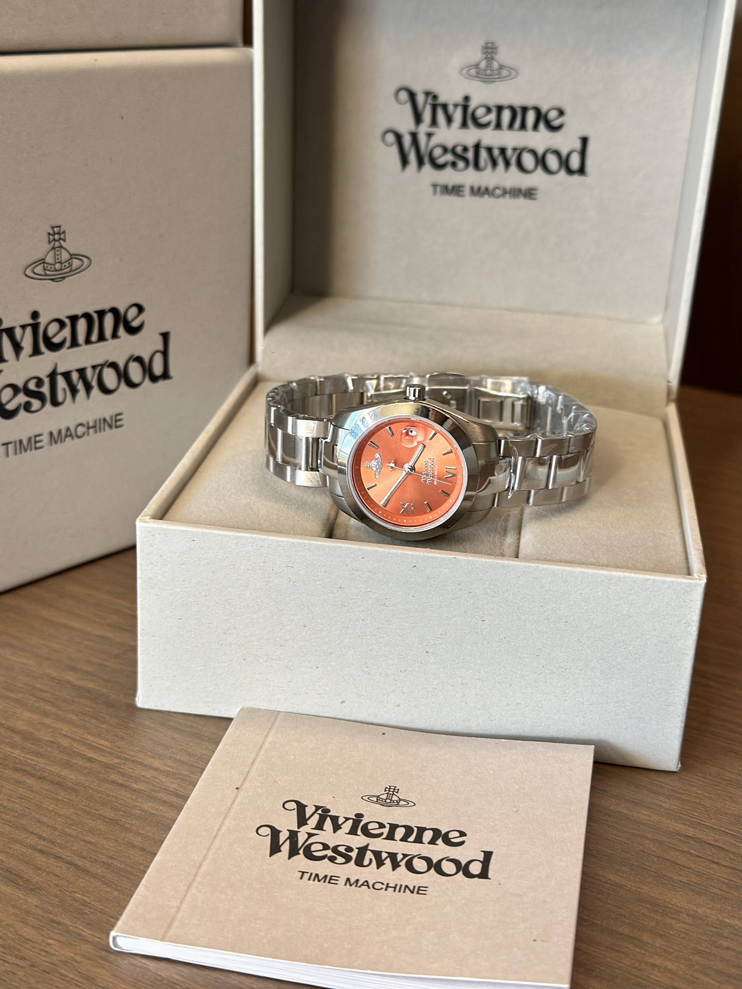 Distinguished by a bold orange dial paired with a silver-tone bracelet - Jewelry 6