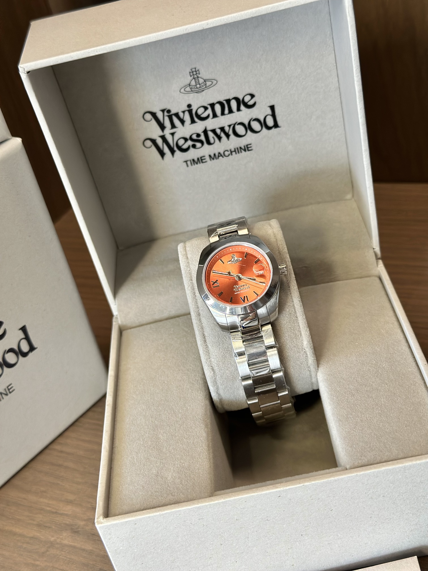 Distinguished by a bold orange dial paired with a silver-tone bracelet - Jewelry 3