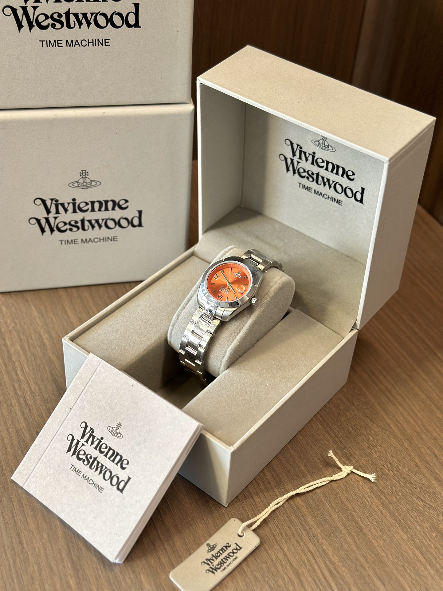 Distinguished by a bold orange dial paired with a silver-tone bracelet - Jewelry 2