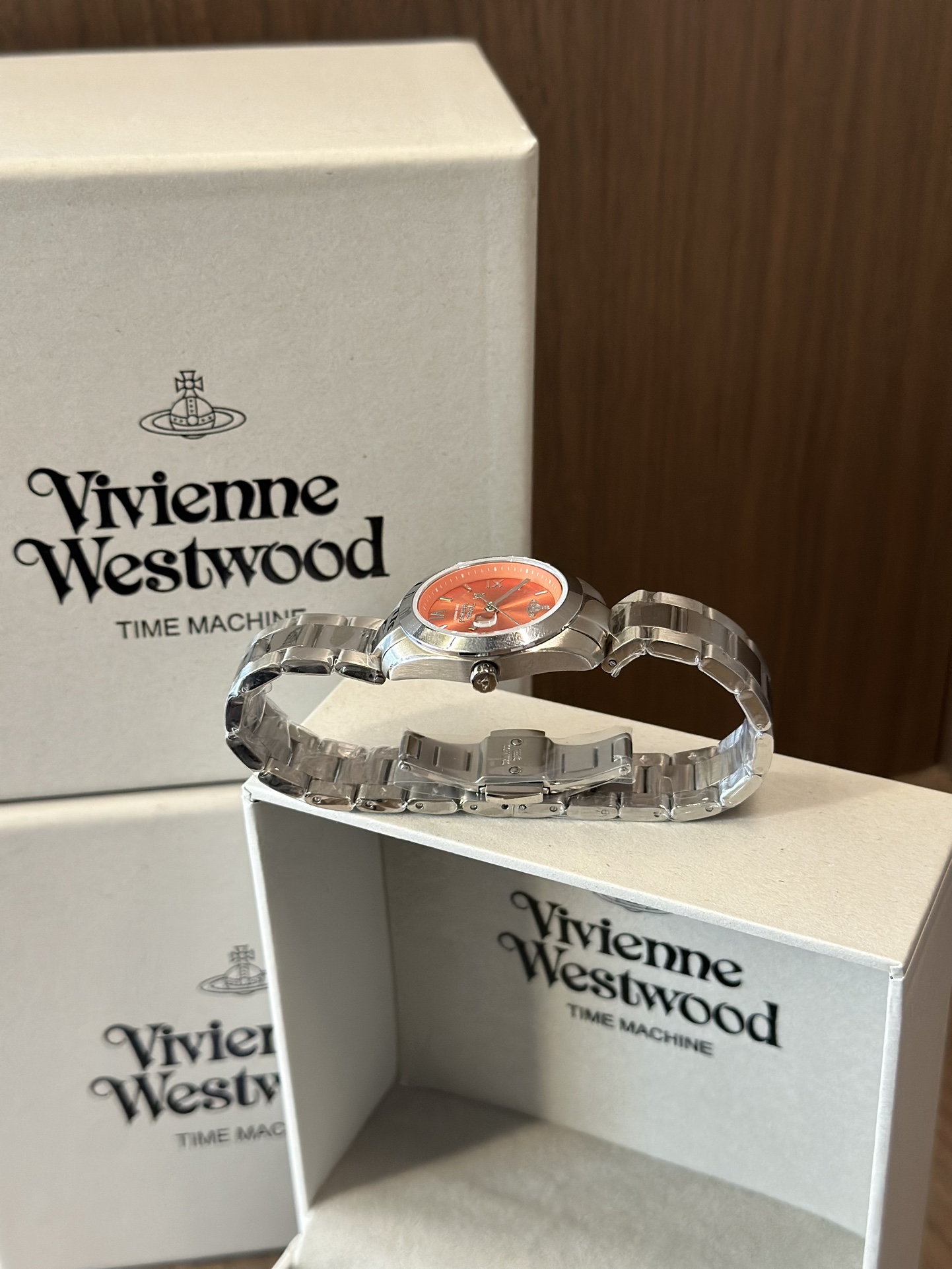 Distinguished by a bold orange dial paired with a silver-tone bracelet - Jewelry 7