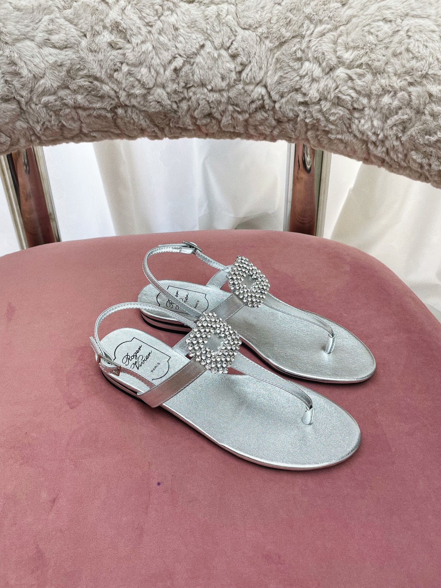 Title: Roger Vivier Summer Sandals Collection Overview Summary: Parisian brand Roger Vivier releases European-style sandals with unique details like square diamond embellishments, Italian leather soles, and custom buttons