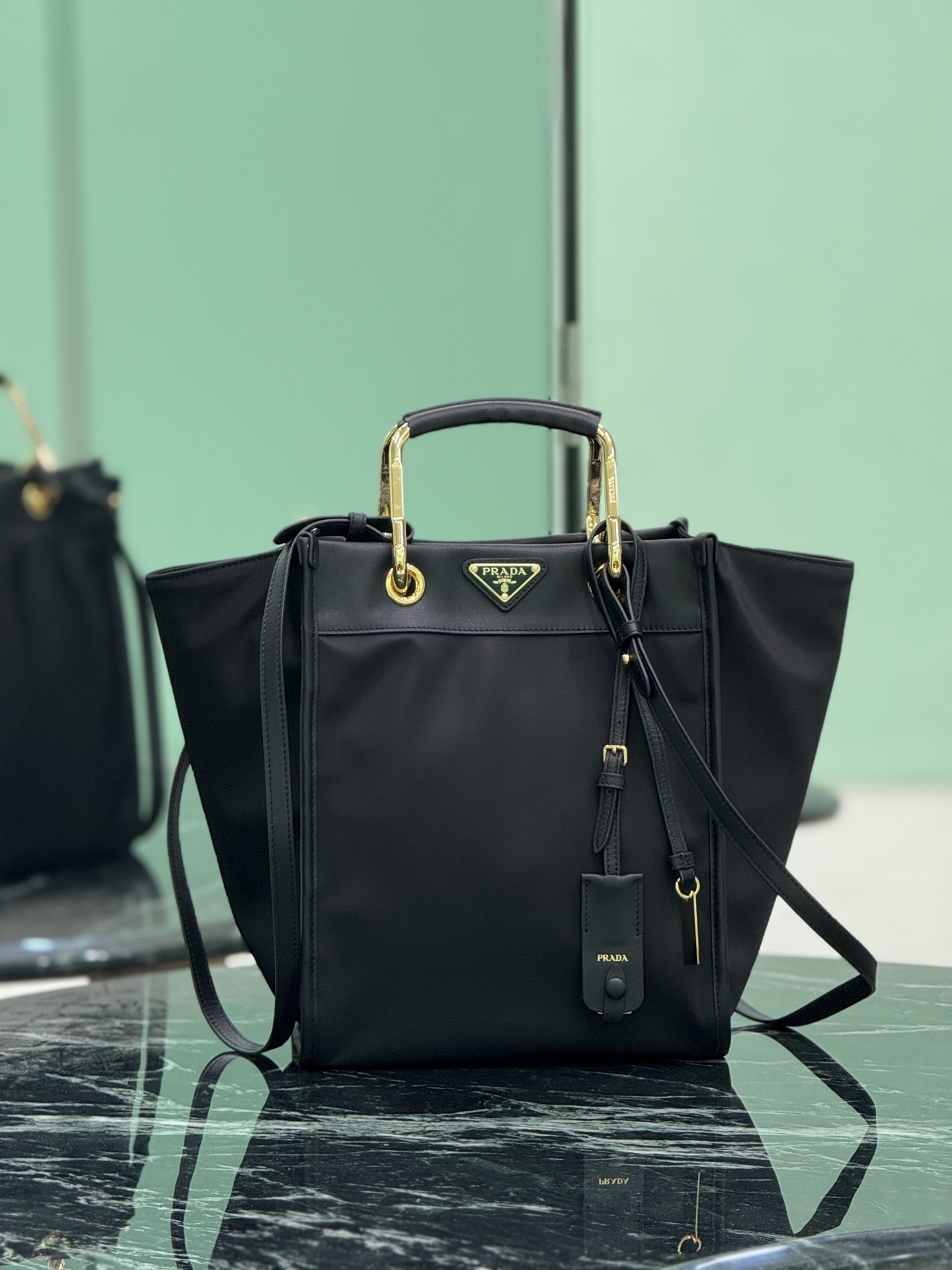 Prada Re-Nylon Tote Bag with Geometric Design and Metal-Leather Handles