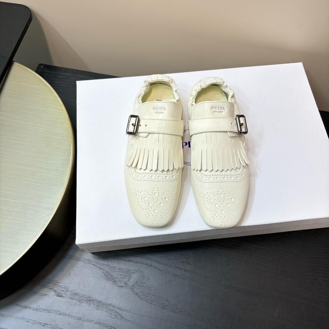 PRADA mocassins à franges cuir blanc cassé