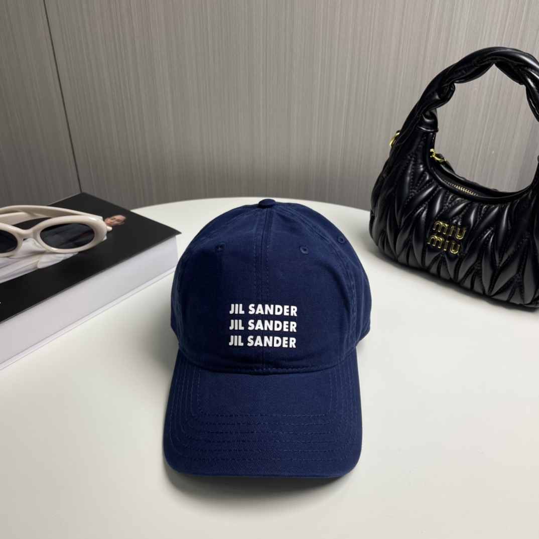 Minimalist Pure Cotton Baseball Cap by Jil Sander with Colored Eye Detail