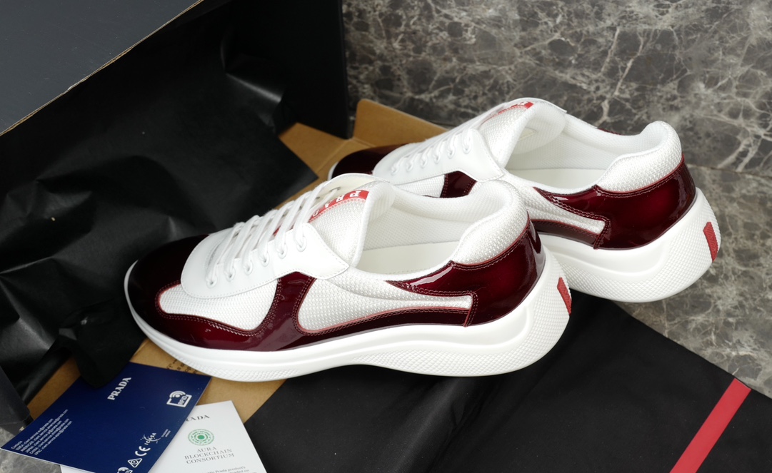Prada America's Cup Leather-Trimmed Sneakers in Bordeaux/White 9 i1731219646 1547 4