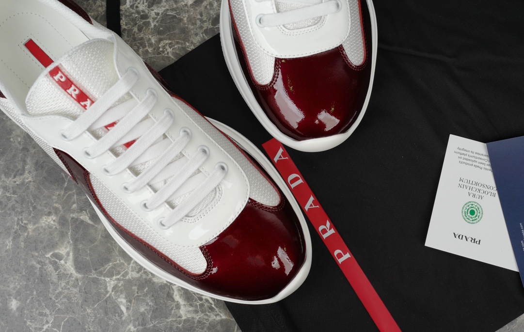 Prada America's Cup Leather-Trimmed Sneakers in Bordeaux/White 7 i1731219646 5043 5