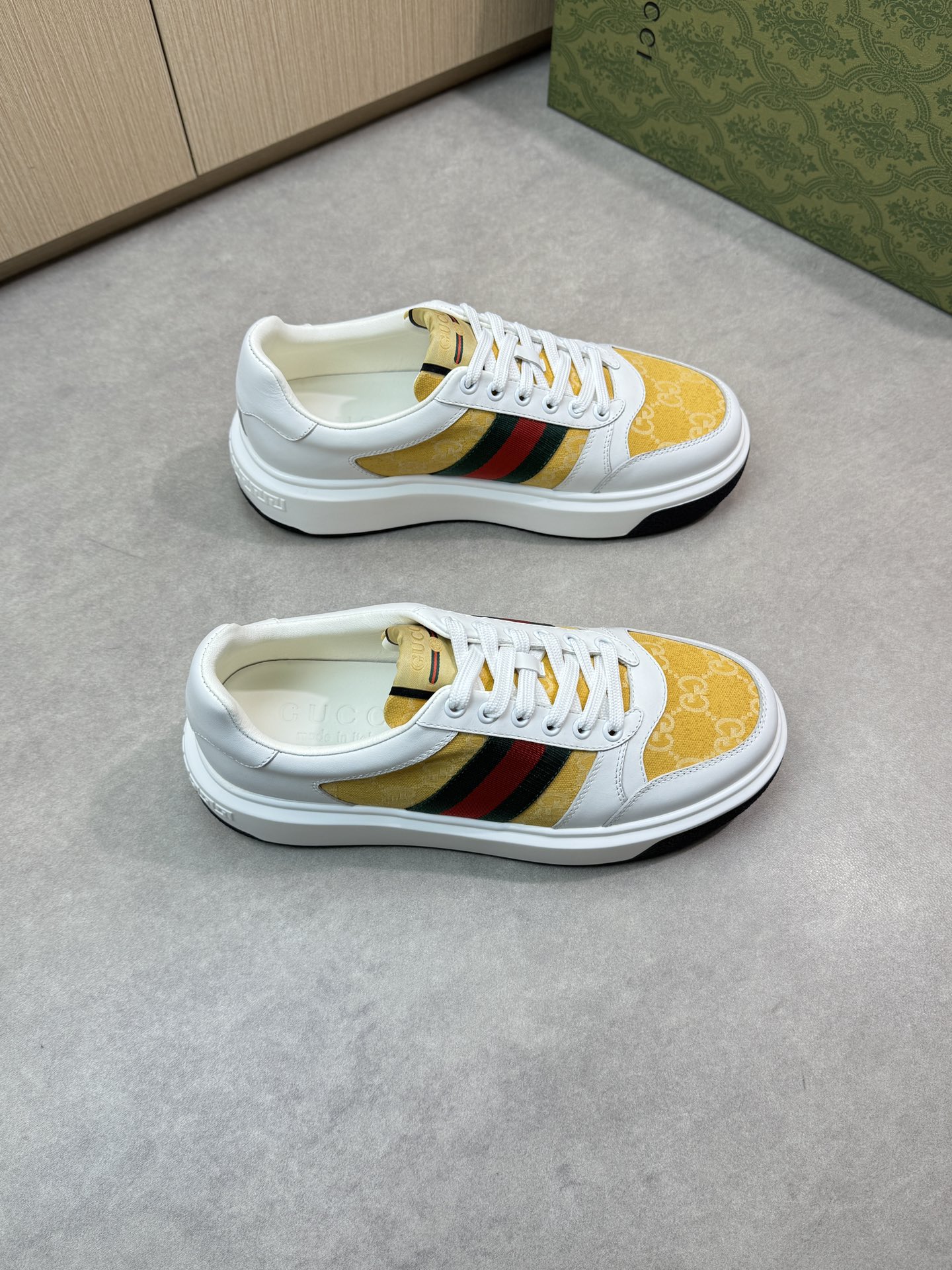 Gucci Men's Leather Sneaker with Web stripe and gold Gucci print 2 i1743355748 5744 0