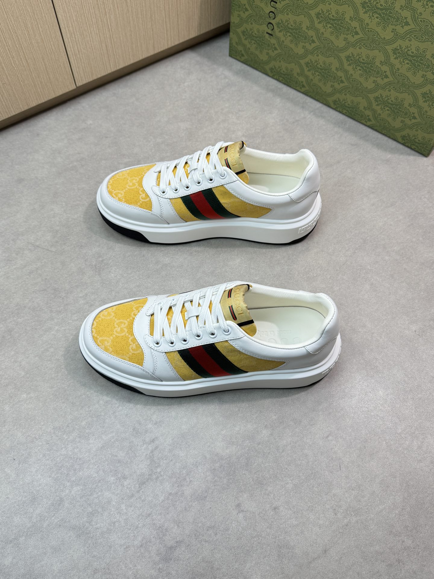 Gucci Men's Leather Sneaker with Web stripe and gold Gucci print 4 i1743355748 7555 2