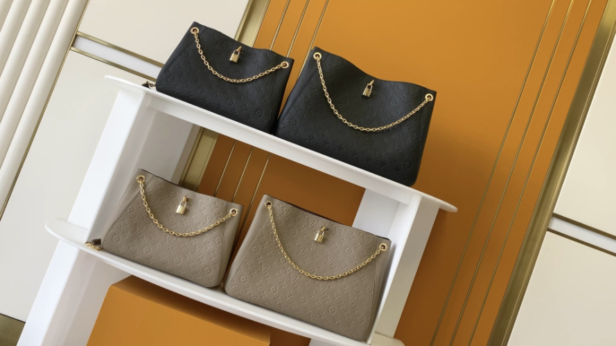 Louis Vuitton Lockme Embossed Leather Shoulder Bag with Chain Accent