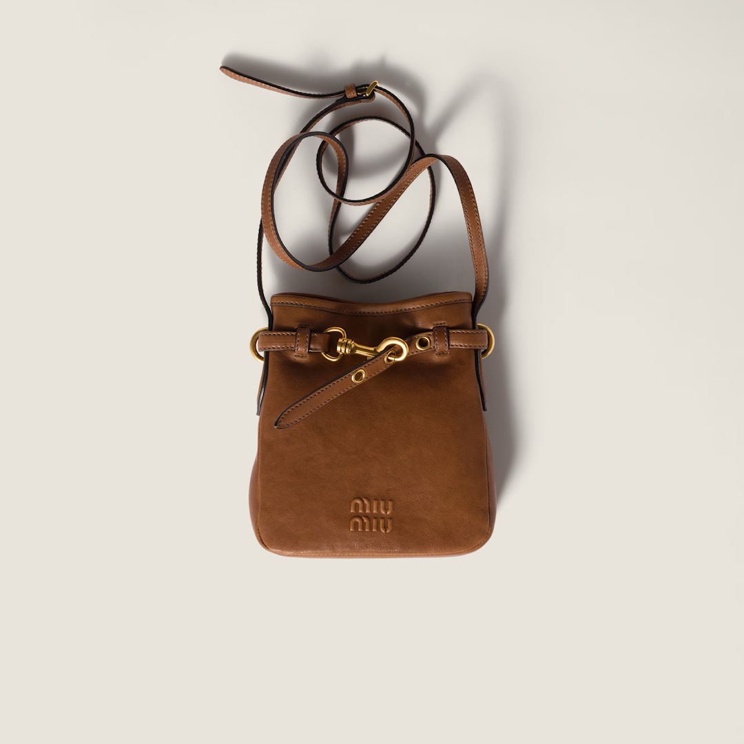 Min Min's new Mini Lucky Bag is here again! This crossbody bag is super versatile, cute, delicate, and soft to the touch. With a magnetic clasp in the middle, you no longer have to worry about things falling out or buying a separate inner lining. It fits comfortably and effortlessly on your body, making it easy to carry around casually. Material: Imported sheepskin. Comes in original factory packaging. Size: Height 19cm, Width 17cm, Length 4.5cm. Color: Oak Brown. image 1