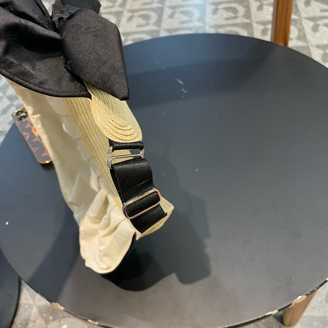   普拉达Prada蝴蝶结空顶帽子女款新款夏季拼接草编遮阳帽户外国风防晒帽潮