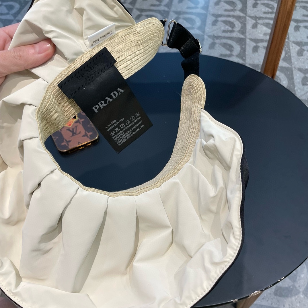   普拉达Prada蝴蝶结空顶帽子女款新款夏季拼接草编遮阳帽户外国风防晒帽潮