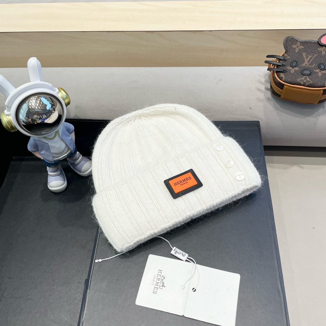 爱马仕Hermes设计师联名款破洞纽扣毛线帽保暖护耳帽百搭针织帽