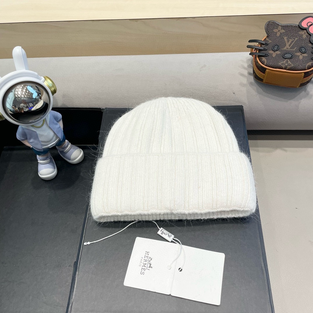 爱马仕Hermes设计师联名款破洞纽扣毛线帽保暖护耳帽百搭针织帽