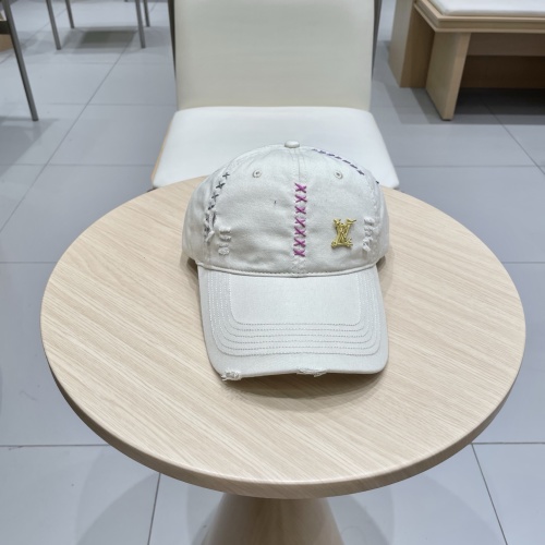 Louis Vuitton Baseball Cap with Distressed Detailing and Signature LV Accent 1 Louis Vuitton Baseball Cap with Distressed Detailing and Signature LV Accent