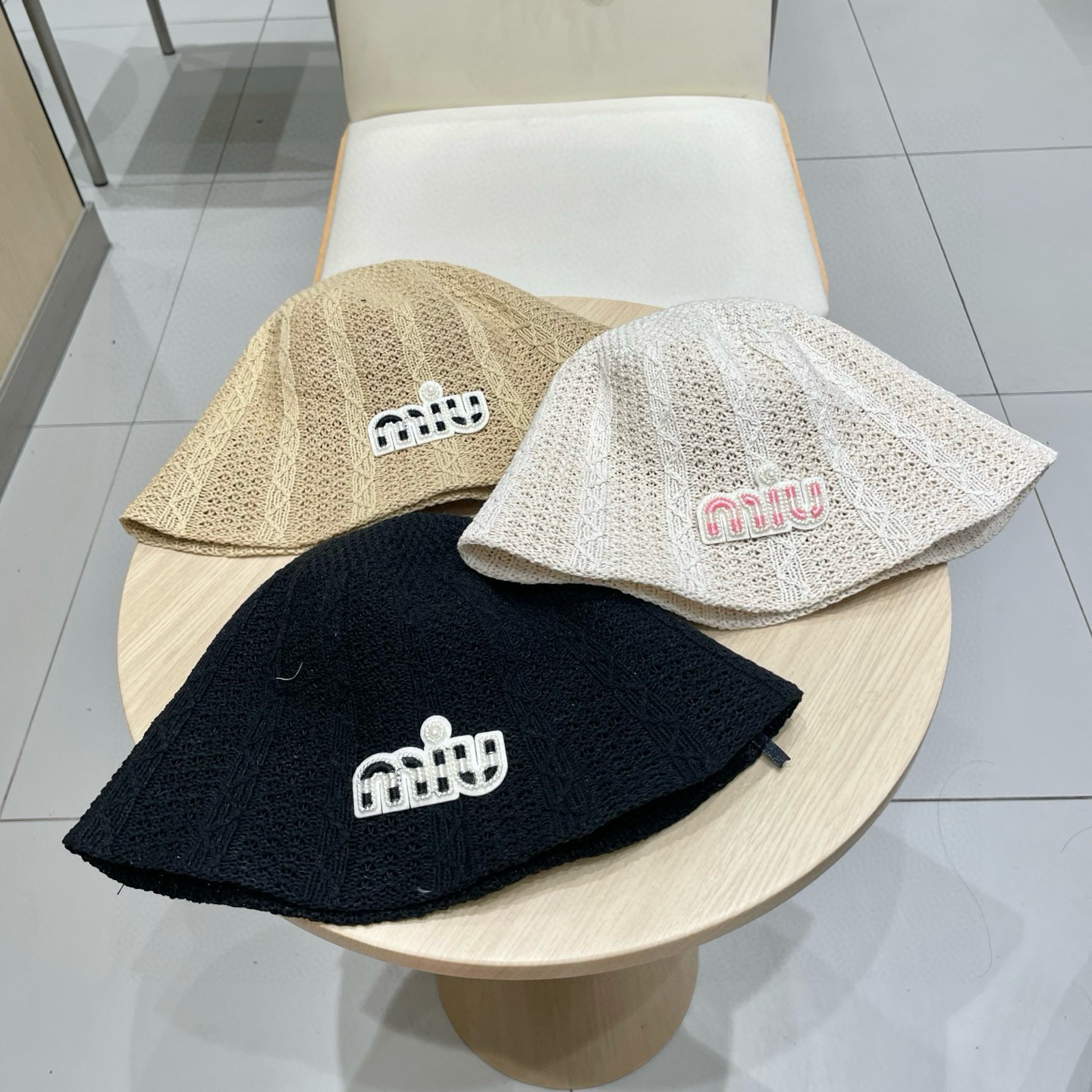  缪缪miumiu春夏新款大头围镂空米色麻花渔夫帽子女简约时尚百搭遮阳防晒盆帽