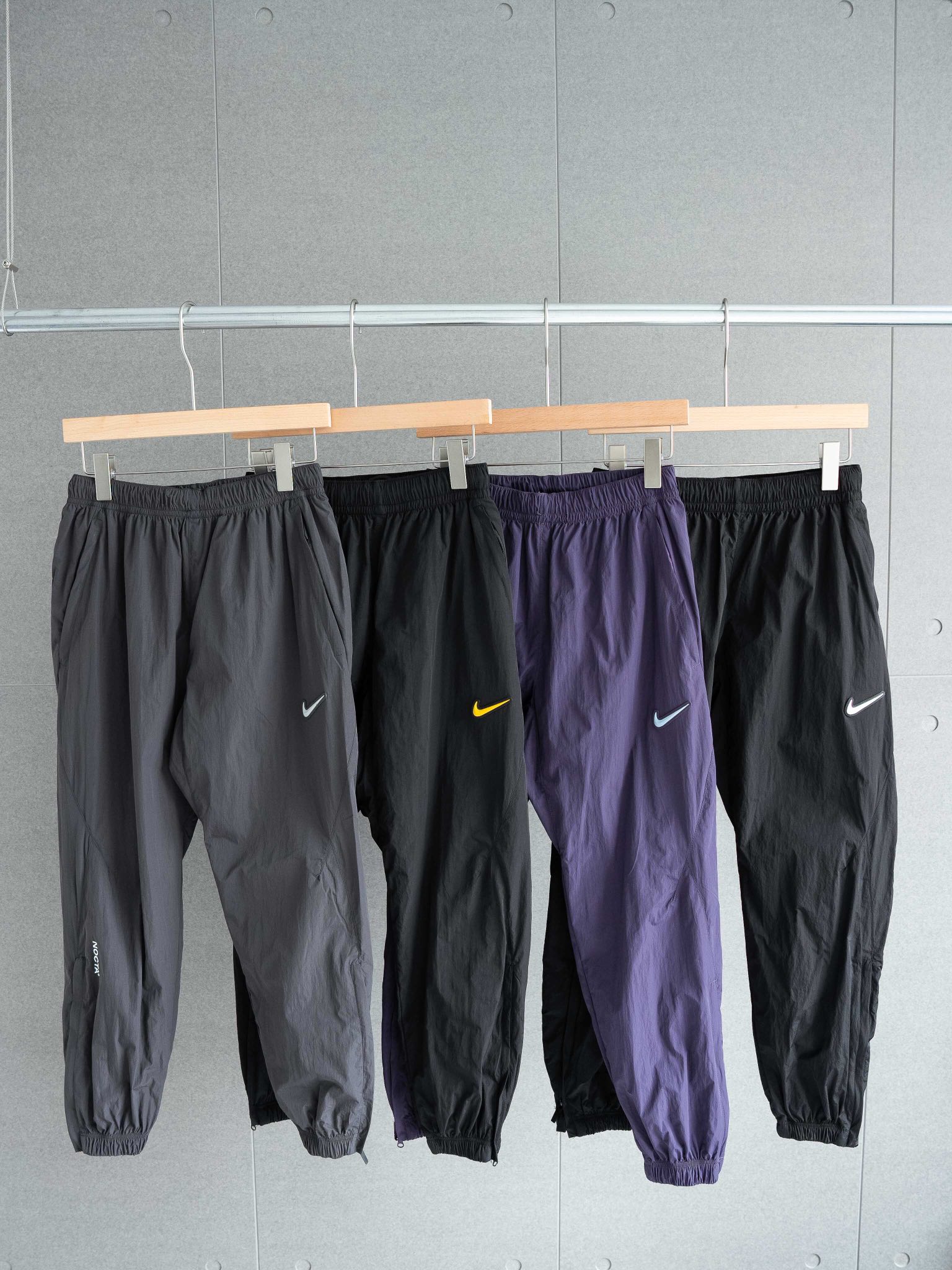 Nike x Drake NOCTA Track Pants: Loose Fit, Zipper Pockets - Four Colors