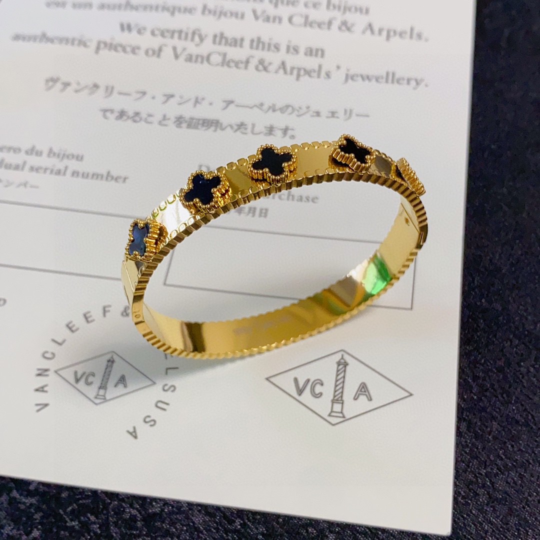 Van Cleef Arpels Alhambra bracelet yellow gold with black onyx and white mother-of-pearl clover motifs 17cm