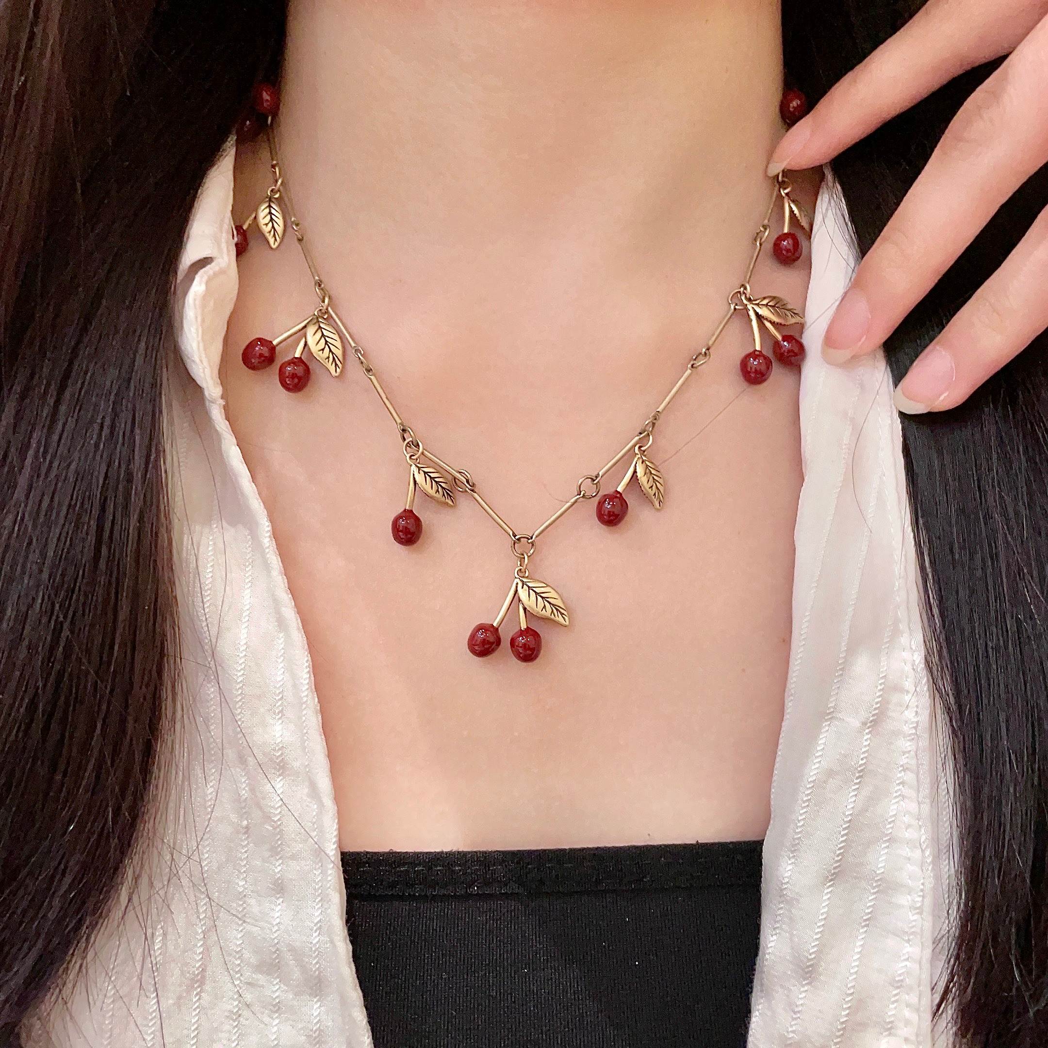 Saint Laurent 1961 Cherry Charm necklace antique gold metal deep red enamel cherry charms 42cm