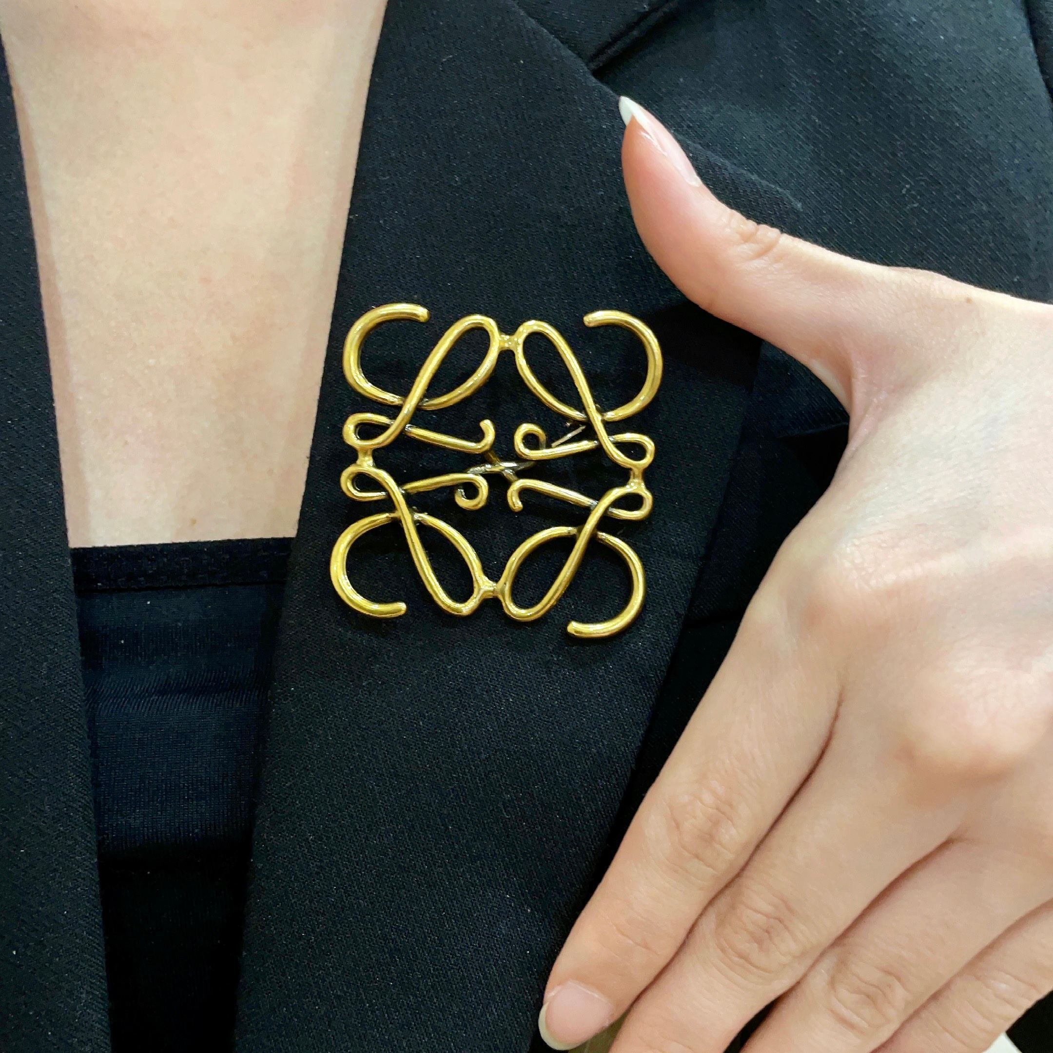 Loewe Anagram brooch antique gold metal no gemstones 4 5cm width