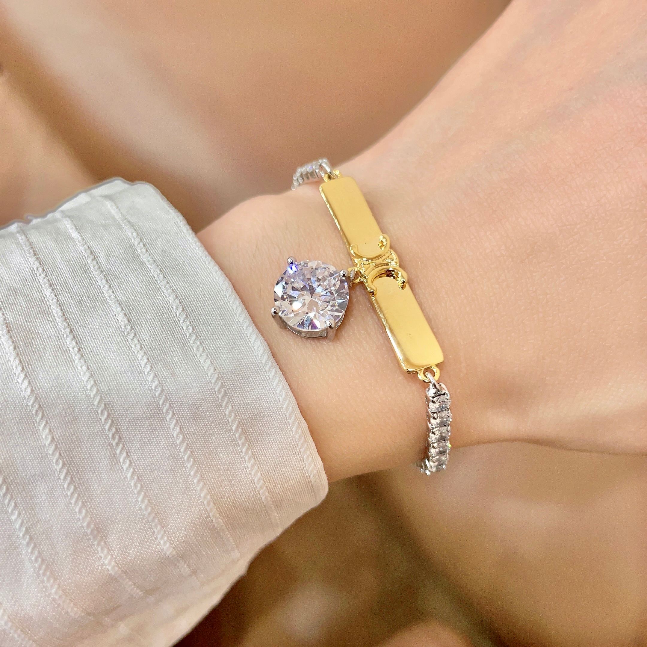 Celine Triomphe Crystal Charm Bracelet bracelet Two-tone gold and silver metal with clear faceted crystal stones 16cm with 5cm extender chain