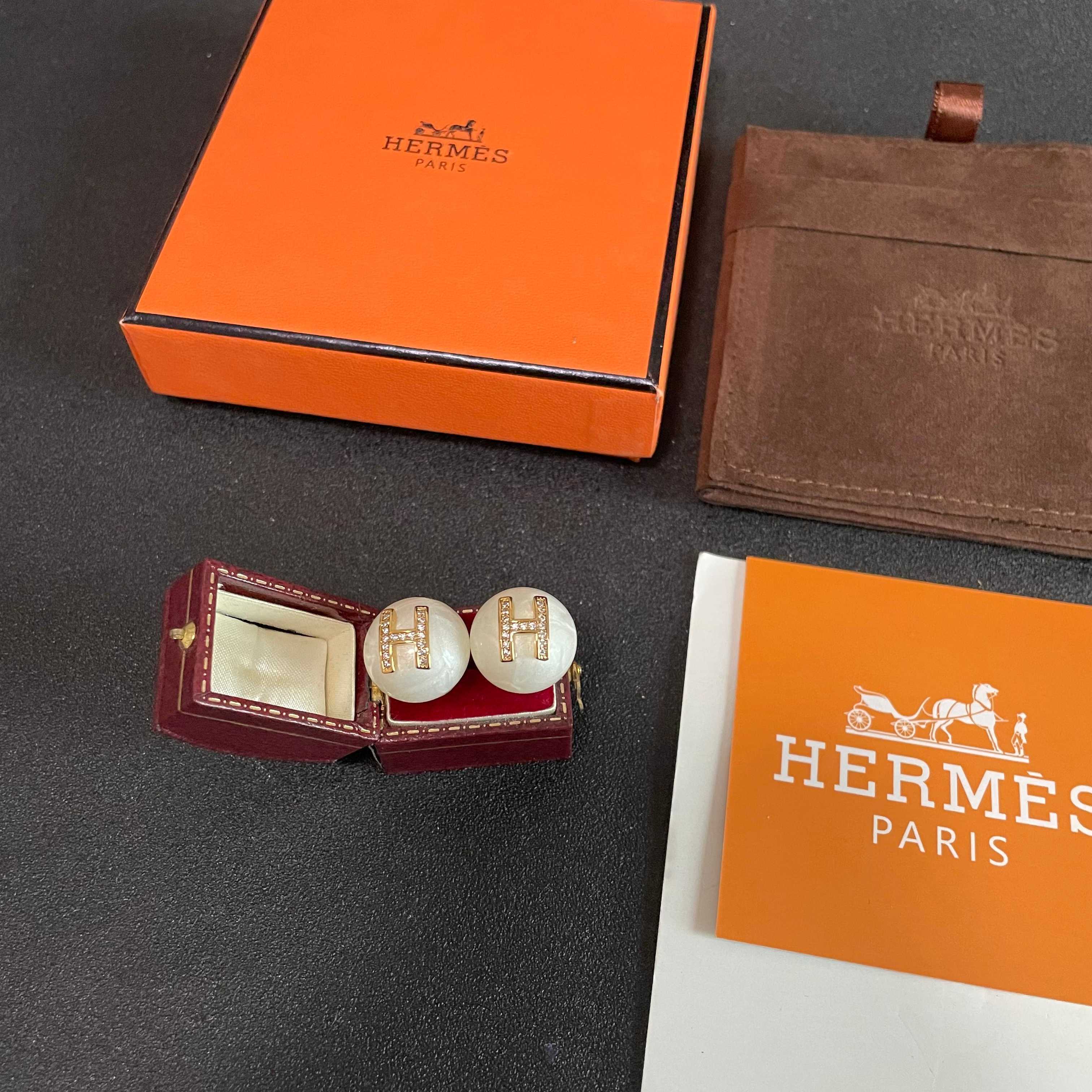 Hermes H Logo Pearl Stud Earrings earrings Cream white pearl base gold-tone metal H logo with clear crystal accents 12mm diameter