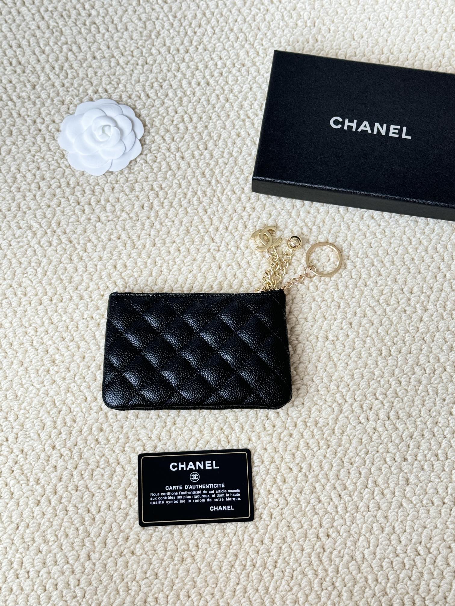Chanel Quilted Caviar CC Zip Key Pouch pendant Black grained caviar leather with gold-tone metal hardware red interior lining 12cm chain length