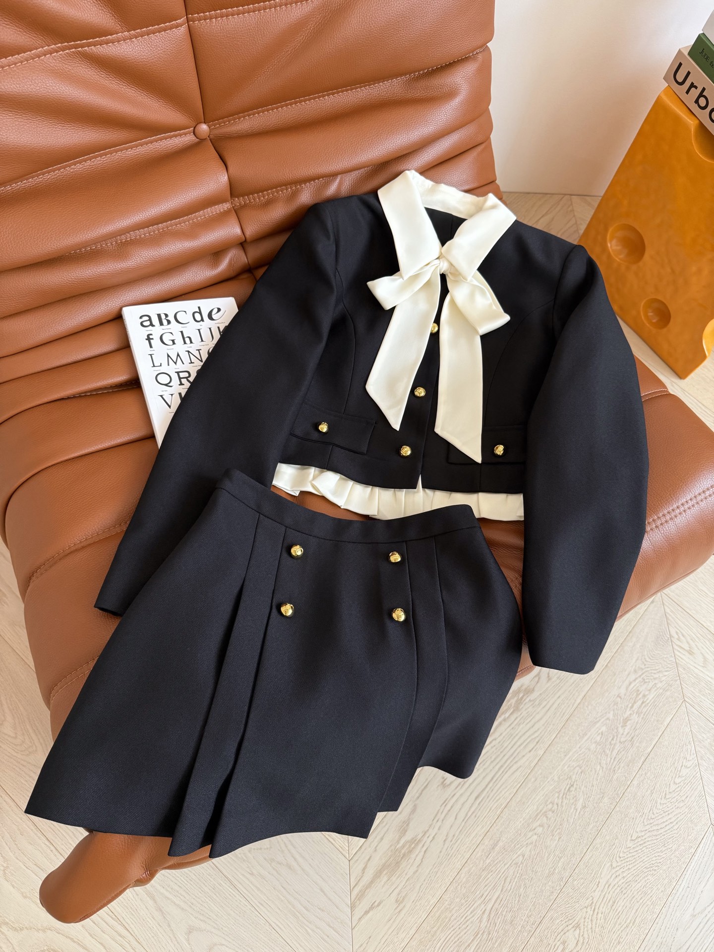 Stylish Feminine Suit Collection: 25 New Items with Bow Tie and Corset