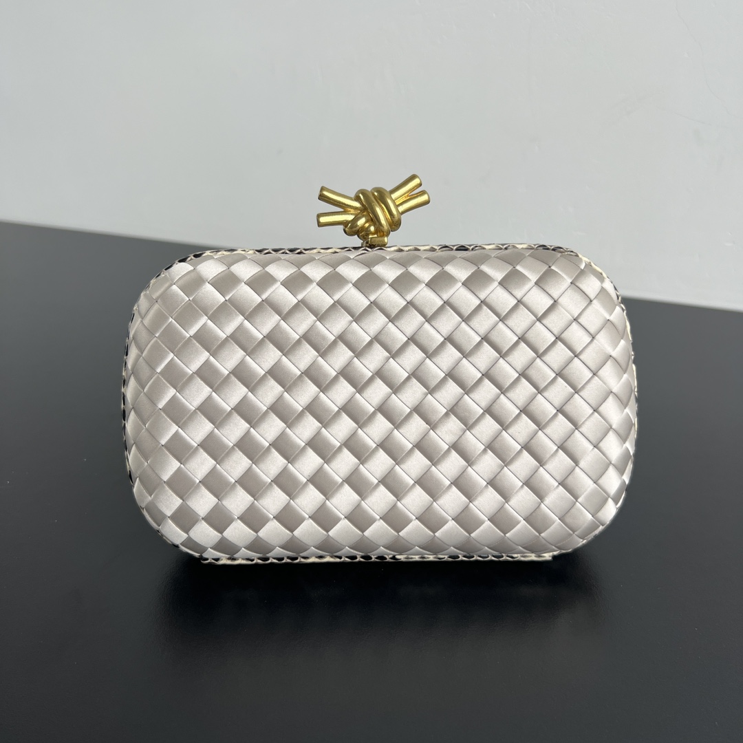 Knot woven evening bag with snakeskin trim and knot clasp