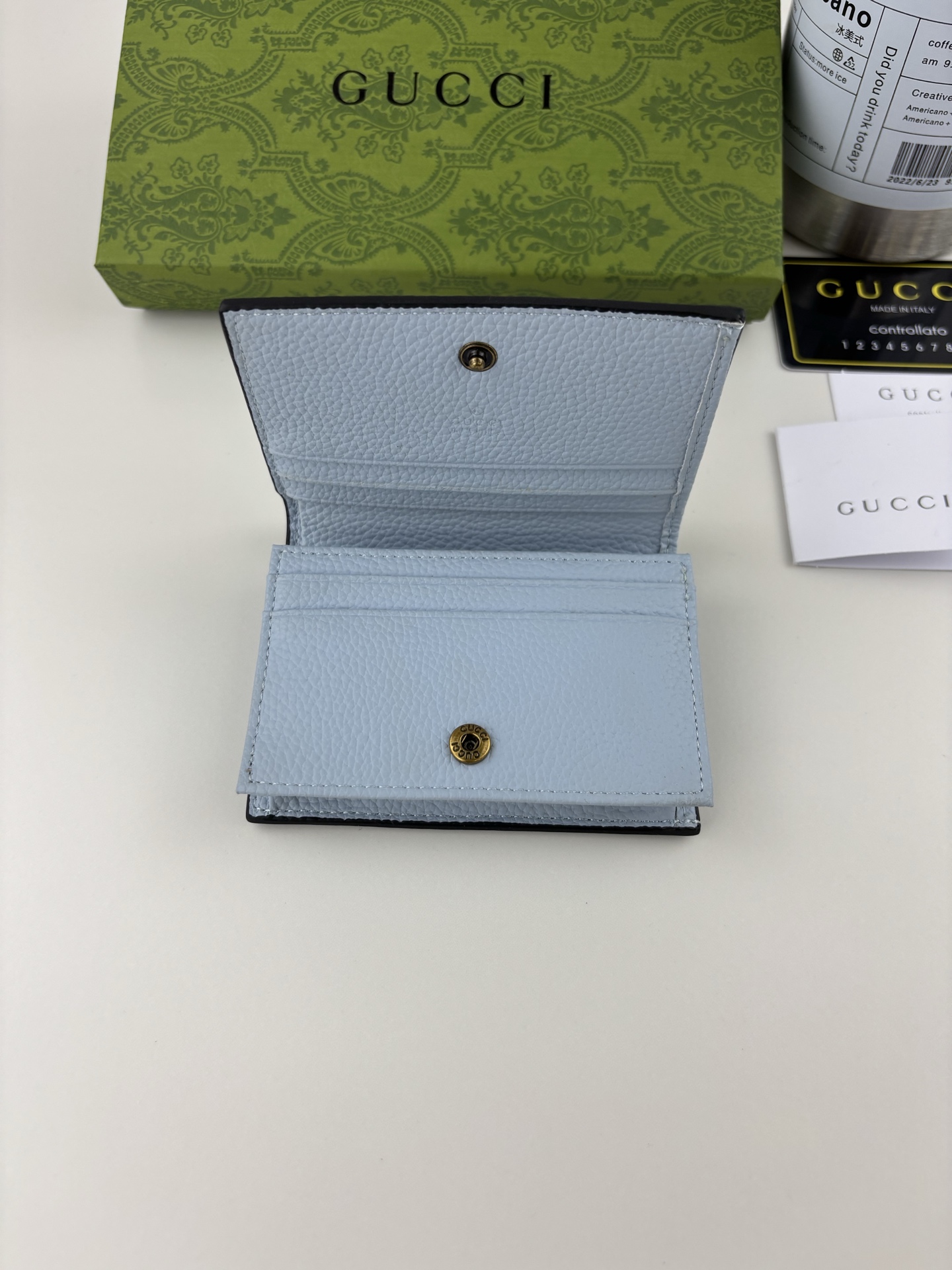 GUCCI 蟒蛇皮蝴蝶結小財布 - 双Gディテールのファッションアイテム