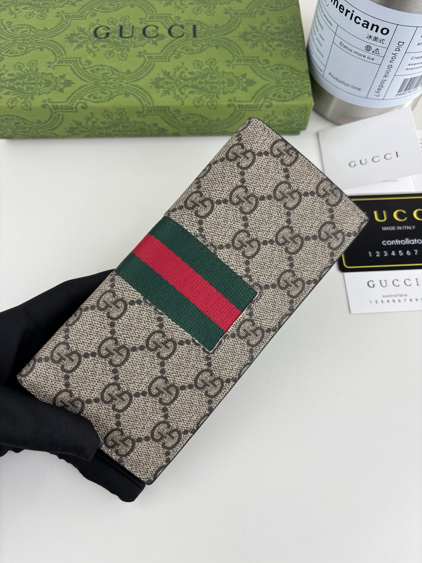 Gucci GGパターンとストライプディテールのクラッチバッグ