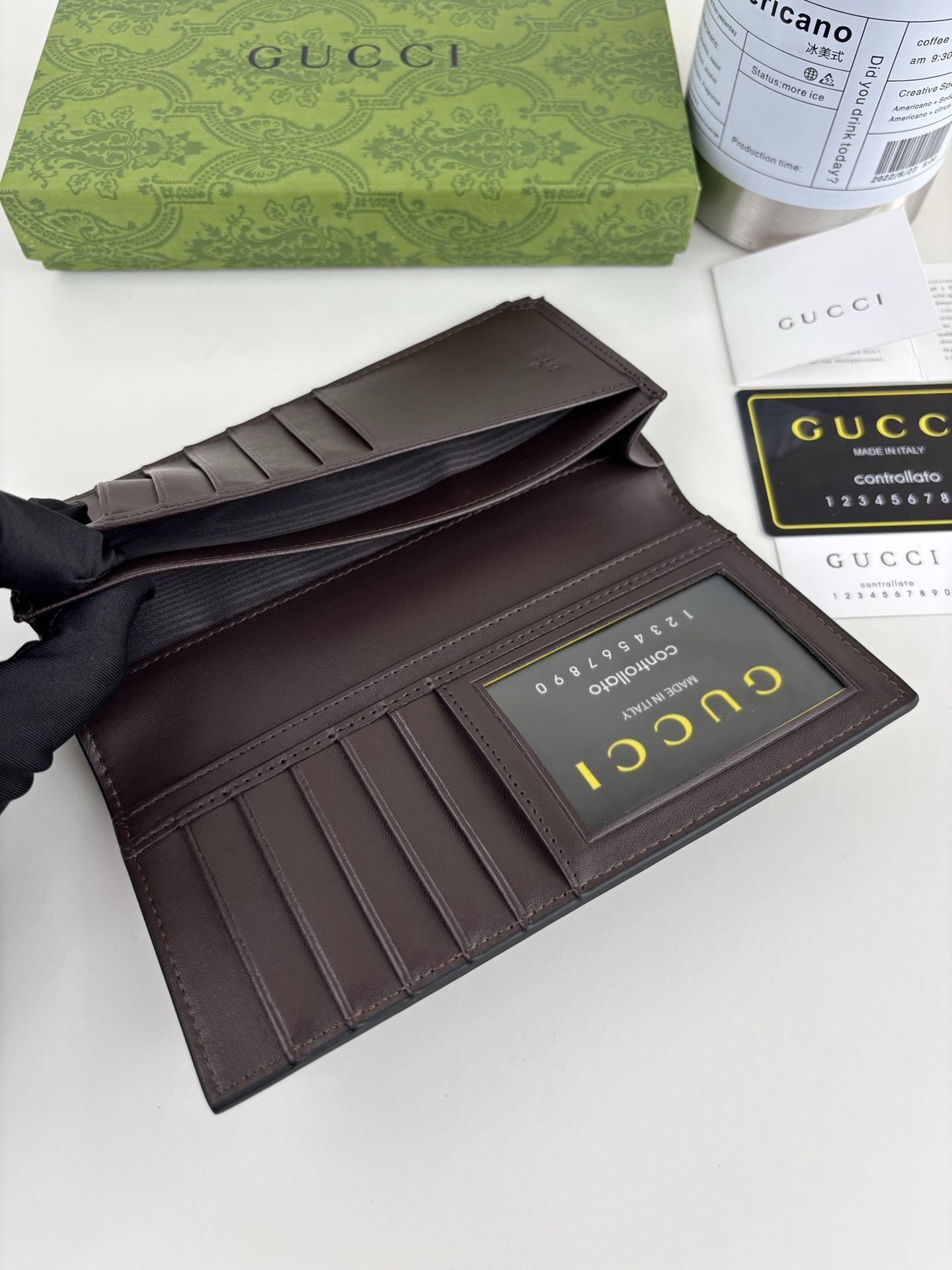 Gucci GGパターンとストライプディテールのクラッチバッグ