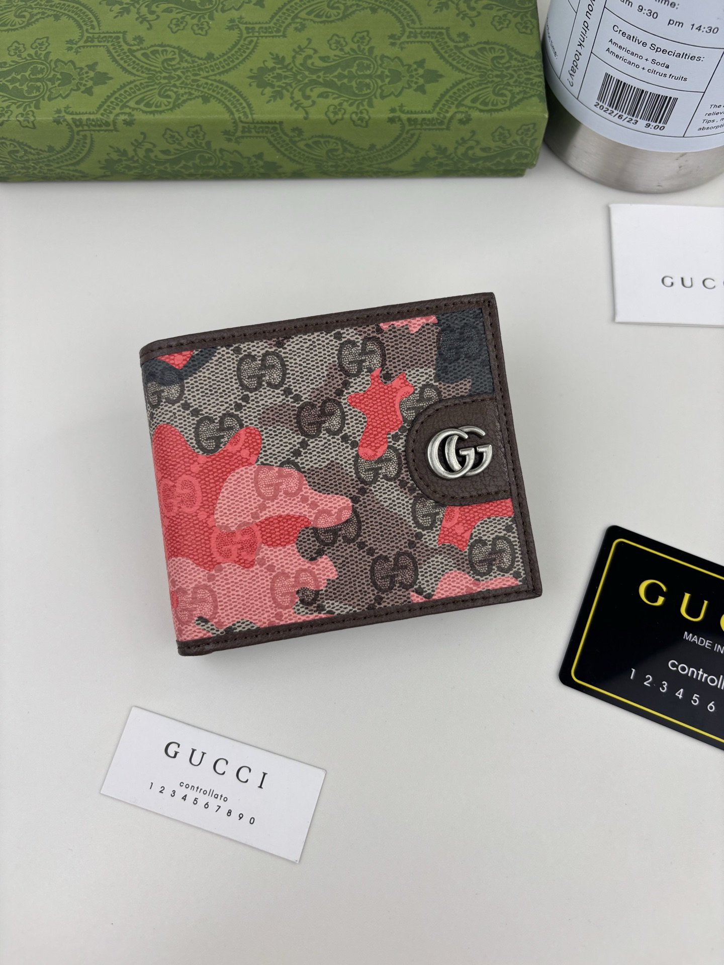 143guccl’s Vivid Camouflage Combined With Unique Color Matching Creates A New Interpretation Of The Classic Gg Pattern. This Bifold Bag Is Made Of Coated Fabric With A Marbled Gg Monogram Pattern And Is Crafted With Double G Details. | Style Number: 834271 | Size: 11cm X 9cm X 1.5cm | Color: Yellow/camouflage