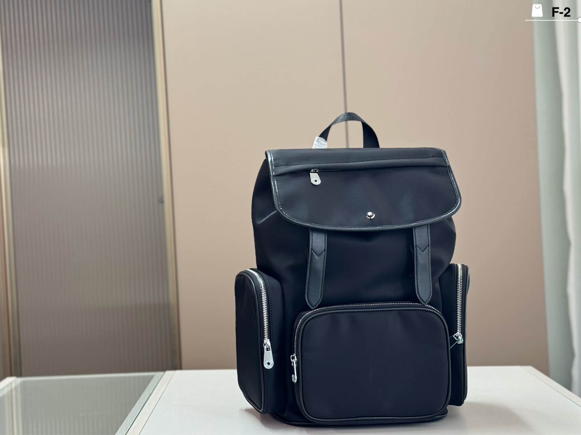 P398 | F-2 Size 28x43 | This Montblanc Men's Backpack Has A Black Simple Design, Leather + Fabric Stitching, Perfect Texture And Durability Multiple Zippered Compartments Make Storage Super Convenient, Making It Easy To Carry Out Commuting And Short Trips.