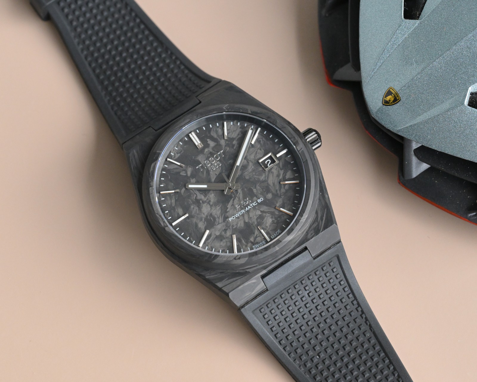 NO:602045,Tissot PRX 'Dark Warrior', the ultimate choice for carbon fiber players. When extreme craftsmanship meets hard-core aesthetics, Tissot PRX Super Player Carbon Fiber Black Warrior is for real watch lovers. The case and dial are made of forged carbon fiber, perfectly replicating the original delicate texture, and every detail can withstand the most rigorous scrutiny. The 40mm gold watch diameter and 11.23mm slim thickness fit the wrist while showing a neat posture.  It is equipped with a replica version of the Powermatic 80 automatic winding movement, which is stable and accurate; the double-sided sapphire mirror is covered with blue light coating, which is transparent, wear-resistant and has outstanding texture. The high-quality fluorine rubber strap brings an excellent wearing experience, and the 75g lightweight design makes you almost forget its existence. The pure black carbon fiber color matching implements the sense of luxury to the end. This 'Black Warrior' is waiting for players from all walks of life to appreciate and collect it.,,tissot,gold19860909天梭PRX“黑武士”,碳纤维玩家终极之选 当极致工艺邂逅硬核美学,天梭PRX超级玩家碳纤维黑武士,为真正的腕表爱好者而来. 表壳与表盘采用锻造碳纤维打造,完美复刻原厂细腻纹路,每一处细节都经得起最严苛的审视.40mm黄金表径搭配11.23mm纤薄厚度,贴合手腕的同时,尽显利落姿态. 内在搭载复刻版Powermatic 80自动上链机芯,稳定精准；双面蓝宝石镜面覆蓝光镀膜,通透耐磨且质感出众.高品质氟橡胶表带带来极佳佩戴体验,而75g的轻量化设计,让你几乎忘记它的存在. 纯黑碳纤维配色,将高级感贯彻到底.这款“黑武士”,静待各路玩家品鉴收藏.,,tissot,gold,Watch