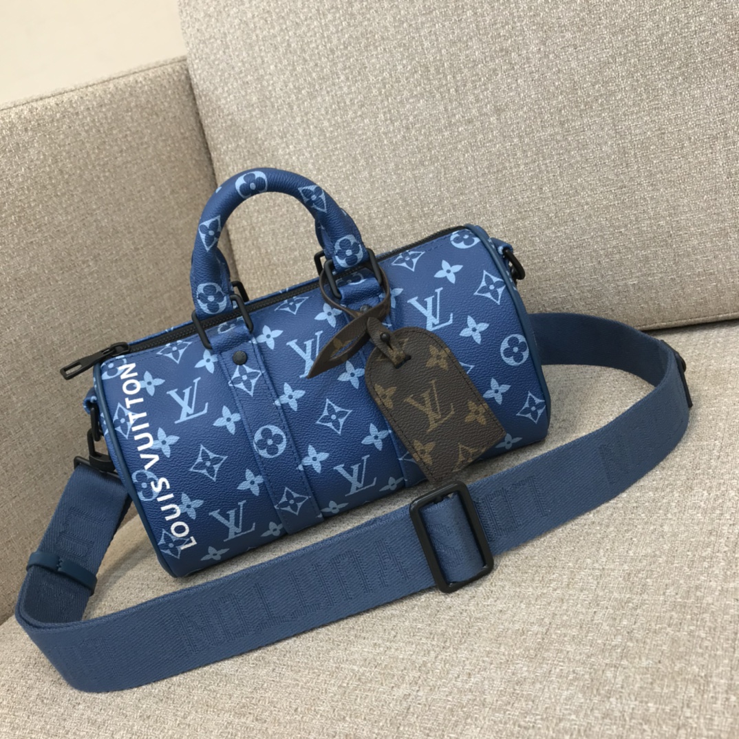 Sac LV Keepall Bandoulière 25 en toile enduite, poignées en cuir roulé, bandoulière large ajustable, porté main ou épaule - Qualité supérieure