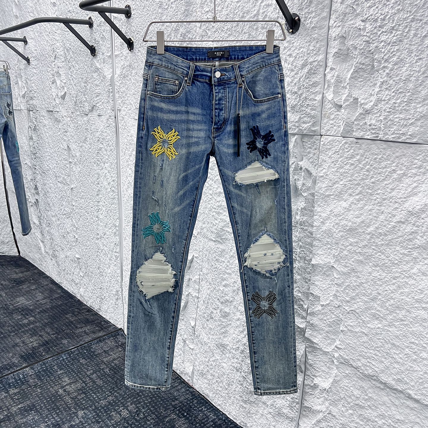 Amiri Distressed Denim Jeans with Floral Patches - Slim Fit, Stylish Design 1 i1748662900232 2547 0 0