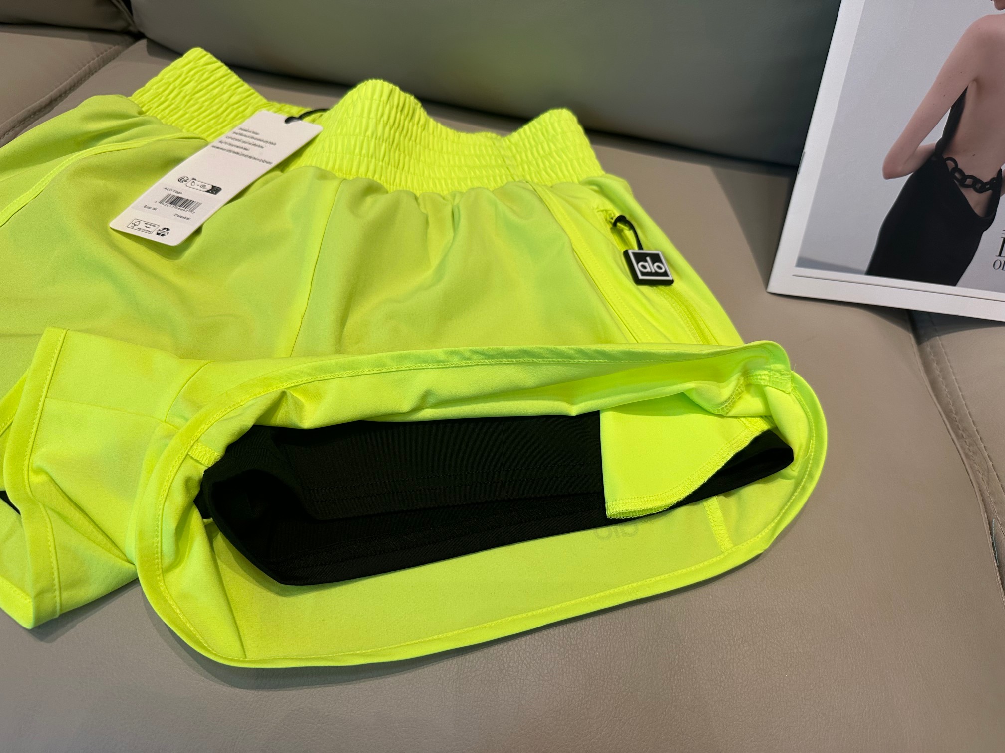 Alo shorts run neon yellow