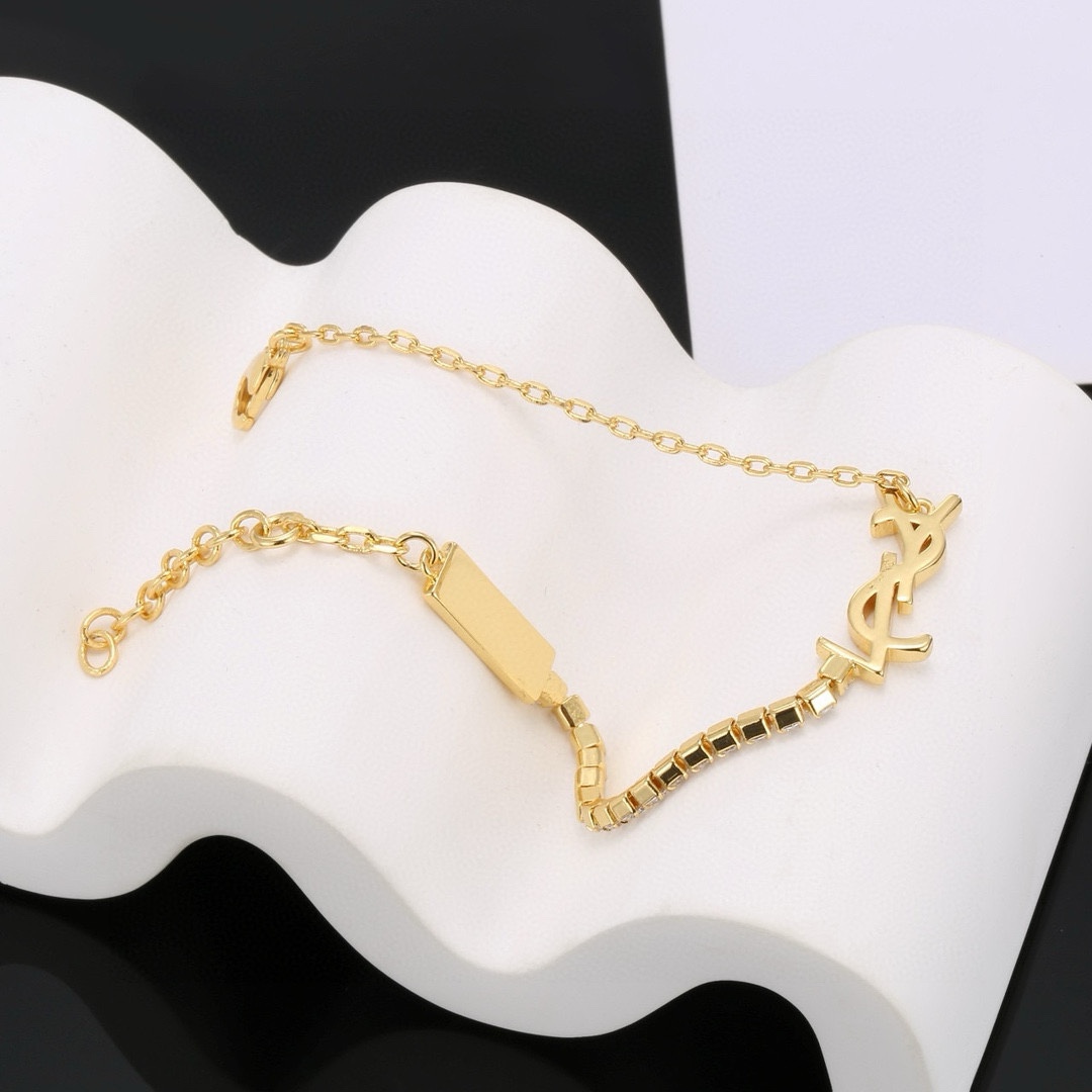 “YSL St. Roland’s Brass Bracelet: Elegant French Fashion Jewelry by Yves Saint Laurent” - 图片 9