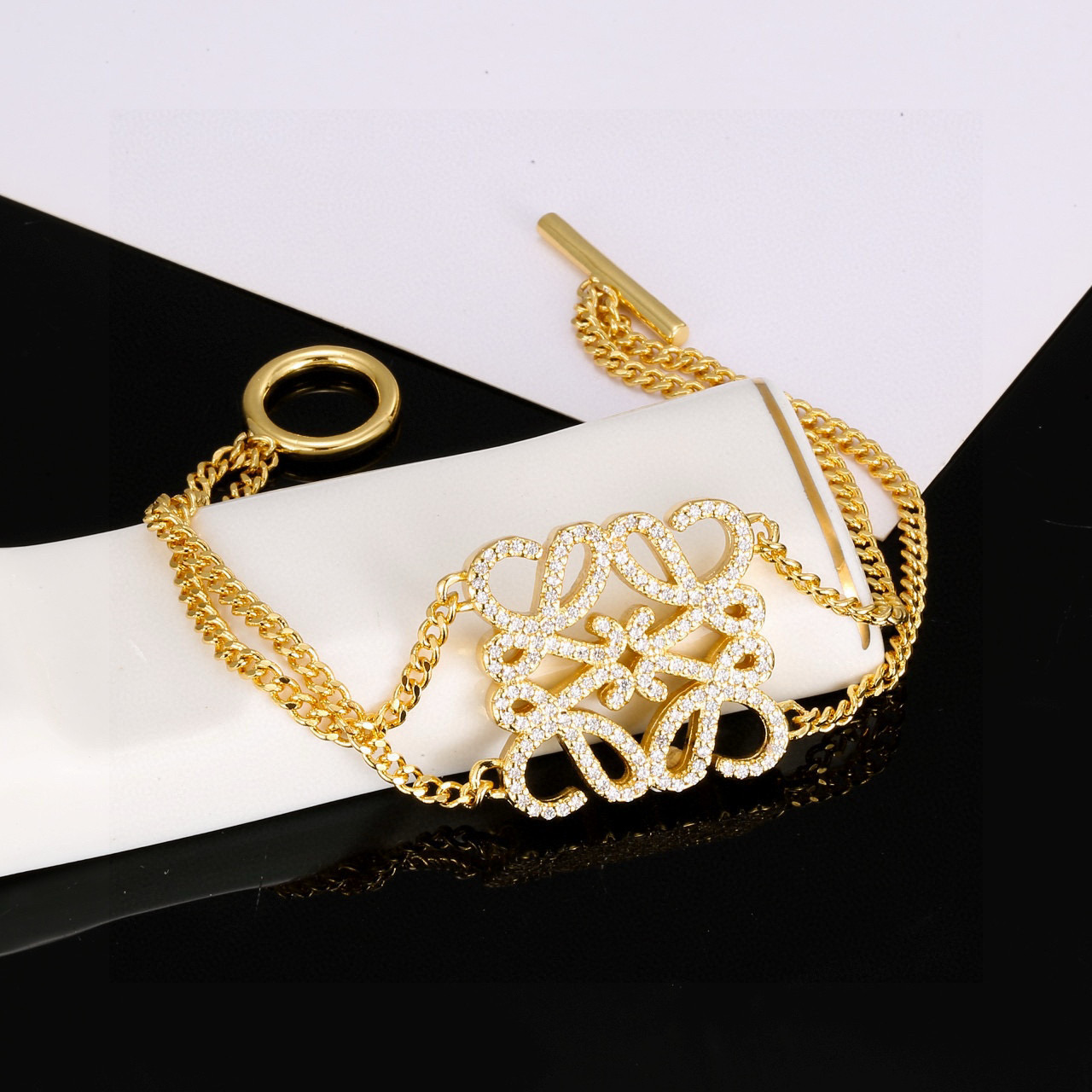 Loewe Inspired Gold-Tone Charm Bracelet with Sparkling Rhinestone Accents for Women