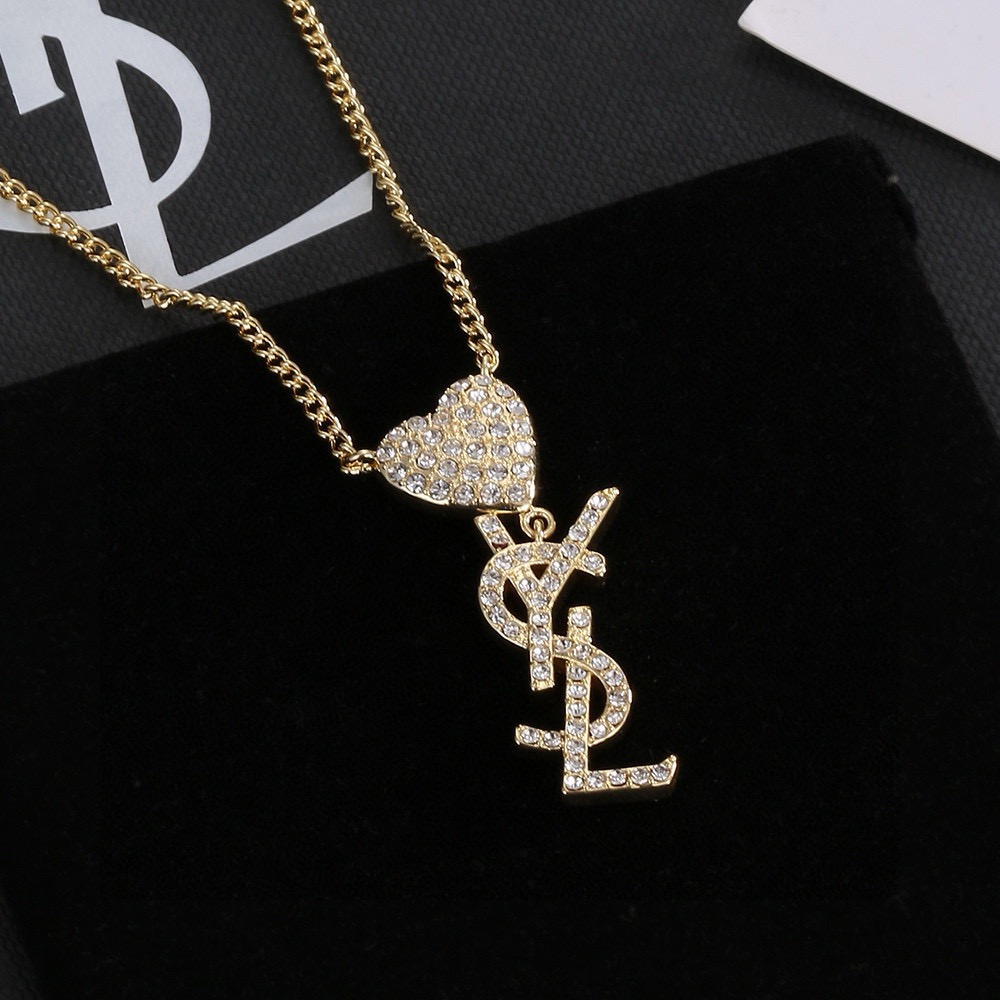 Saint Laurent YSL Monogram Heart Crystal Pendant necklace gold-tone metal with clear crystal accents 45cm with 5cm extender