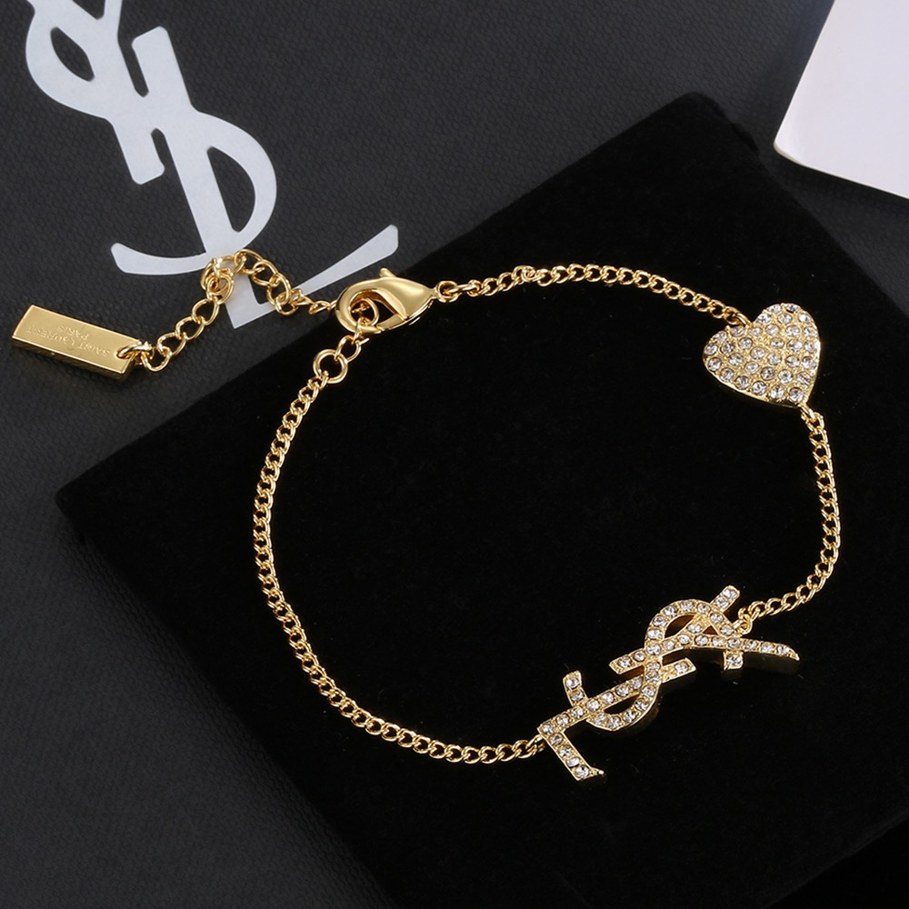 Saint Laurent YSL Monogram Crystal Heart Charm Bracelet bracelet gold-tone metal with clear crystal accents 19cm with 3cm extender