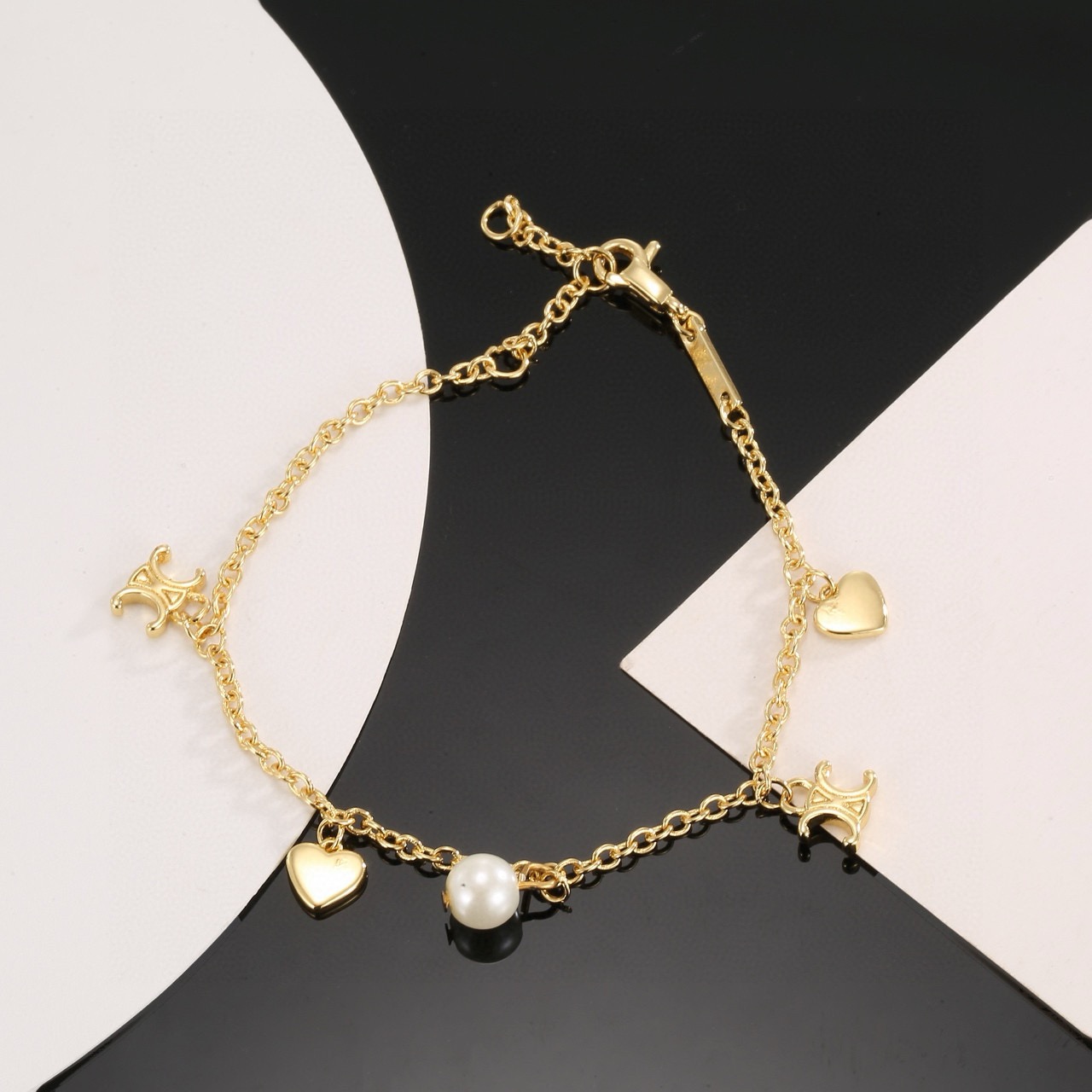 Celine Triomphe Heart Pearl Charm Bracelet bracelet gold-tone metal with white pearl 18cm with 3cm extender