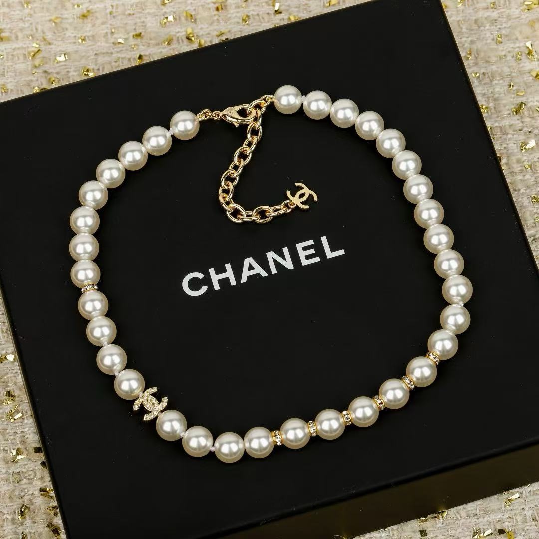 Chanel CC Pearl Crystal bracelet Gold-tone metal cream white faux pearl clear crystal 18cm
