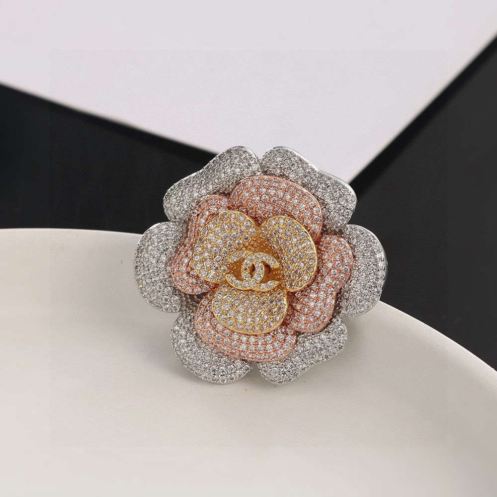 Chanel Camellia ring Tri-tone silver rose gold yellow gold metal with clear pave crystals US 7