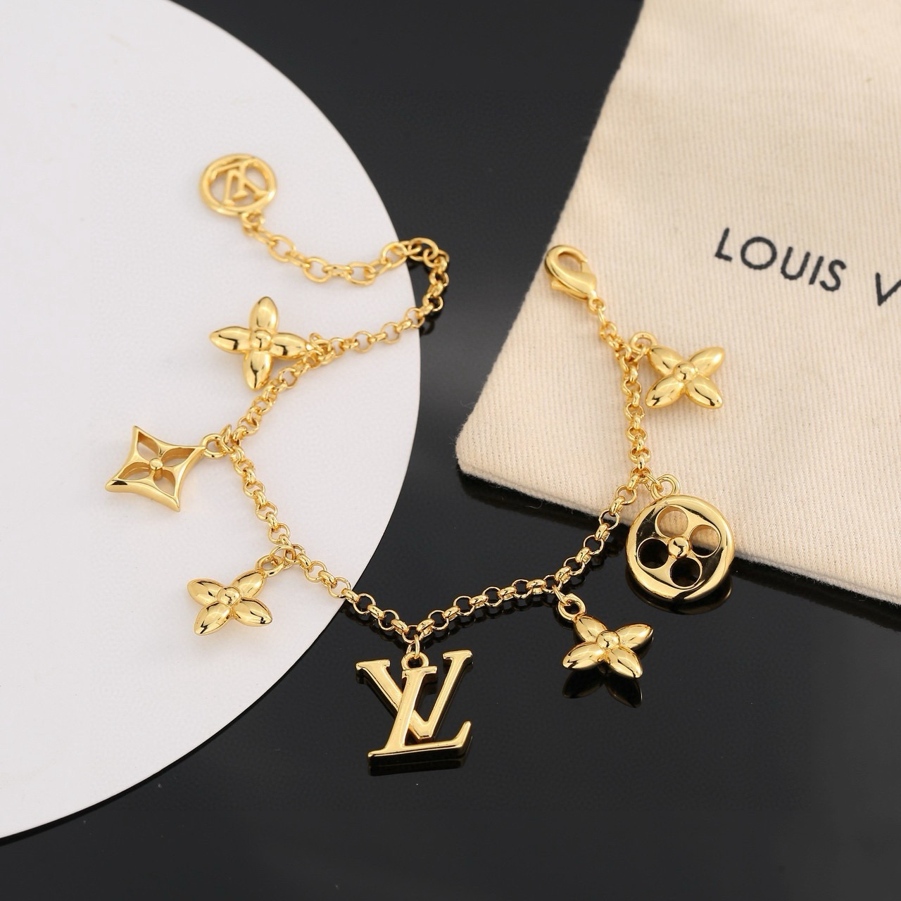louis vuitton gold lv twig charm bracelet