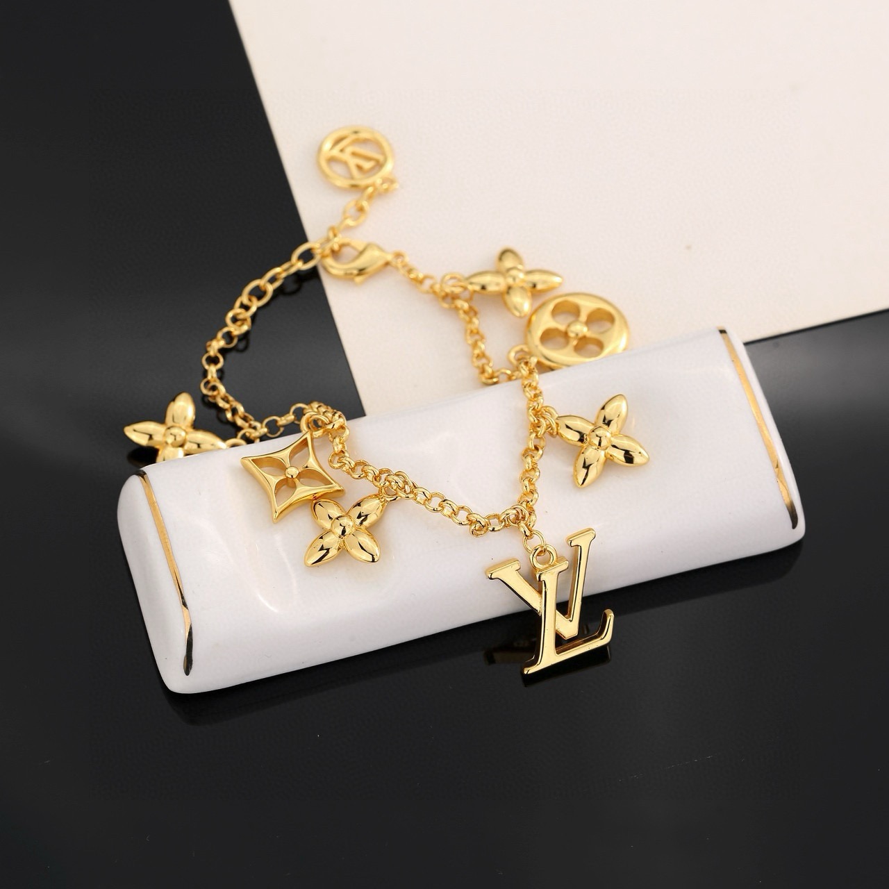 louis vuitton gold lv twig charm bracelet