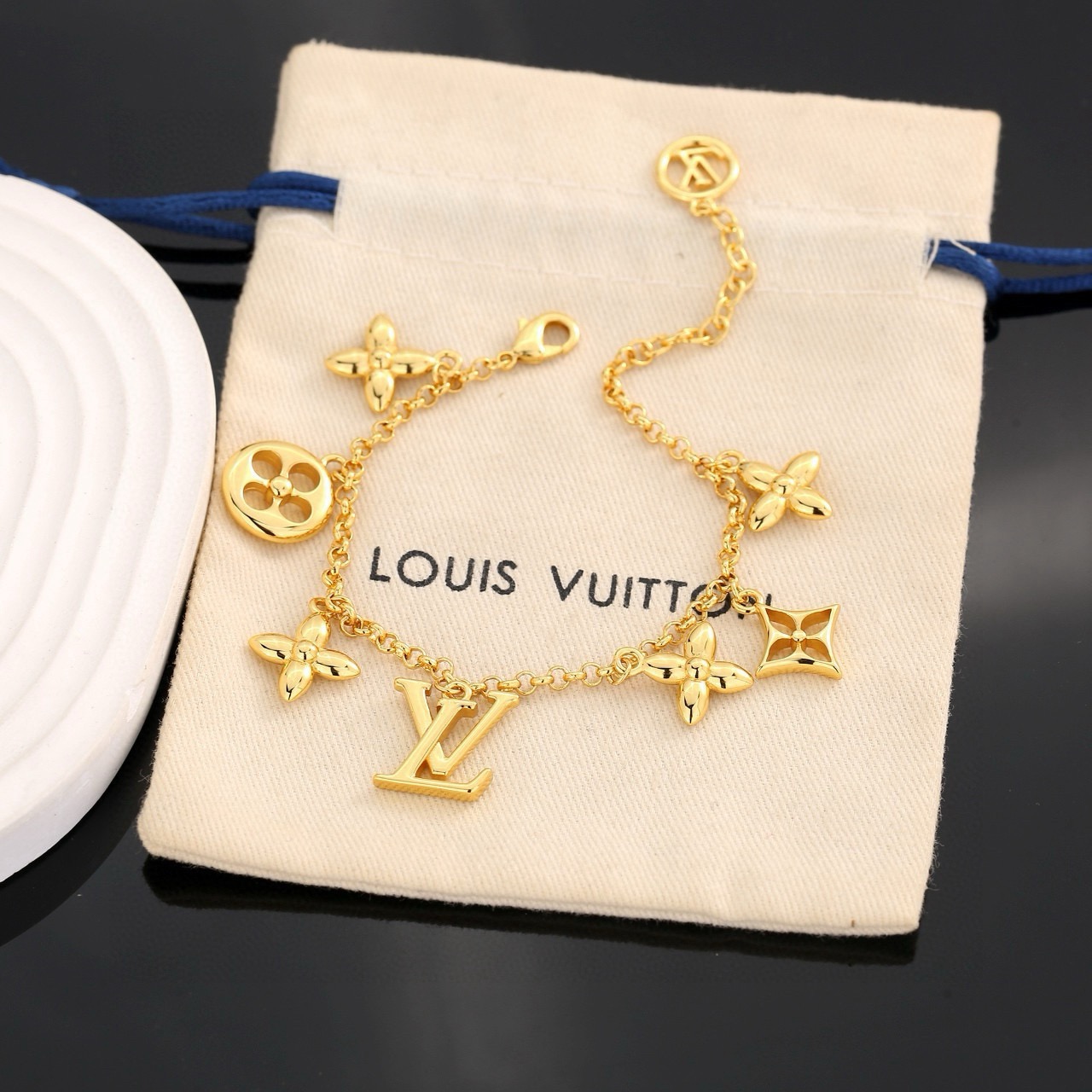 louis vuitton gold lv twig charm bracelet