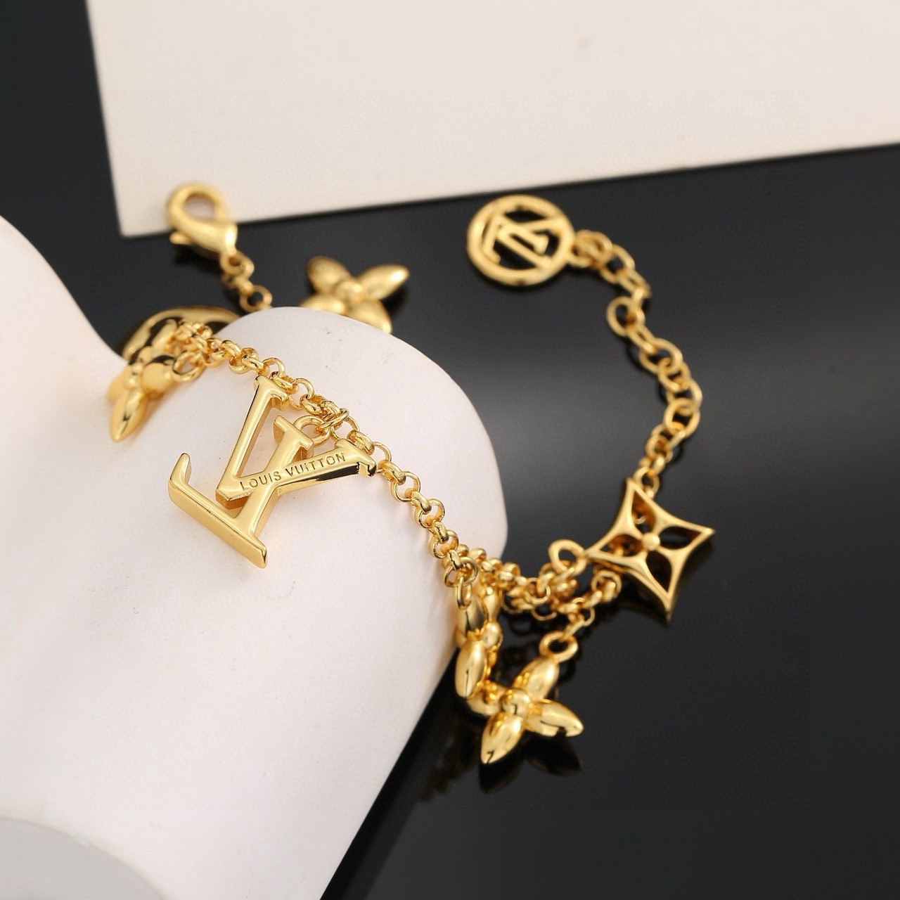 louis vuitton gold lv twig charm bracelet